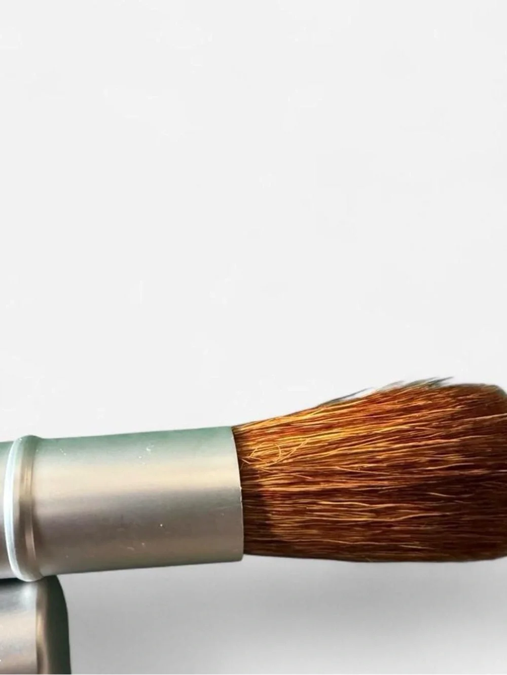 I.d. Bare Escentials retractable travel makeup Brush.